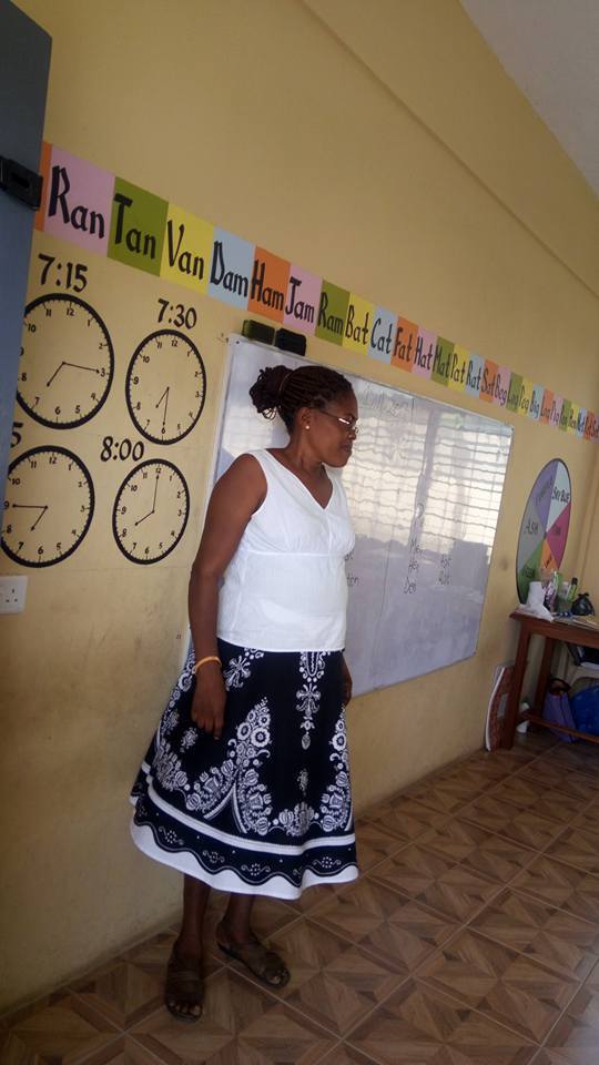 A teacher leading an engaging lesson in a Ghanaian classroom supported by PROaid Africa