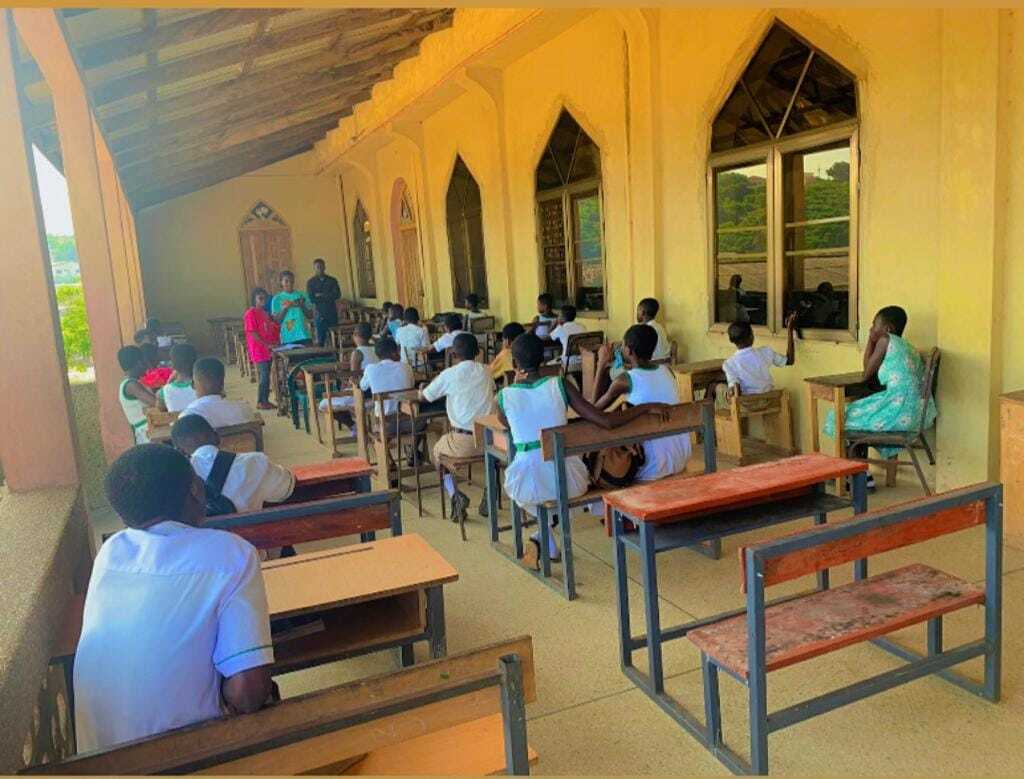 Students learning in an outdoor covered classroom facility built by PROaid Africa