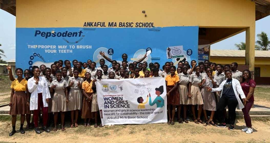 Girls and women participating in a science programme at a PROaid Africa education event