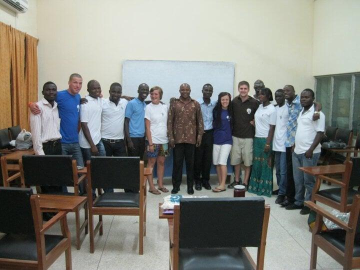 An international and local volunteer group gathered together at a PROaid Africa fundraiser event