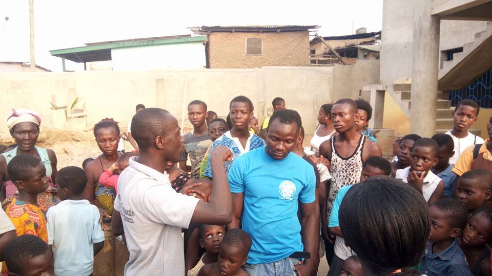 Volunteer crowd address at PROaid Africa outreach event