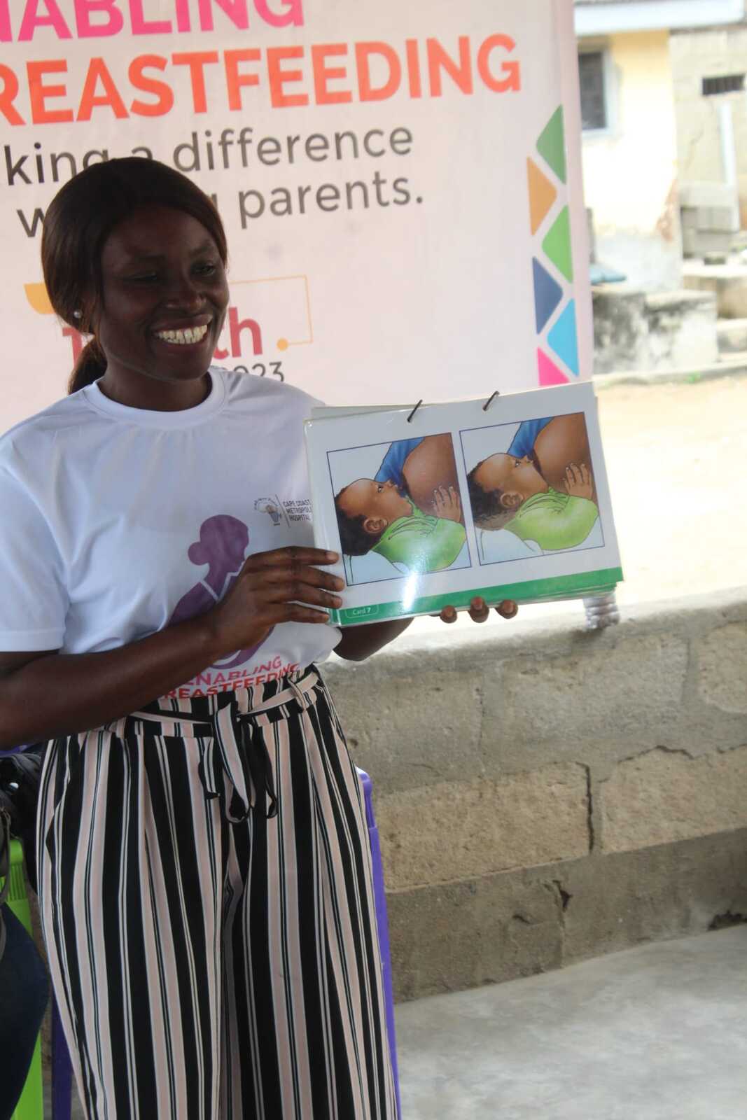 A health presenter educating mothers on breastfeeding at a PROaid Africa wellness session