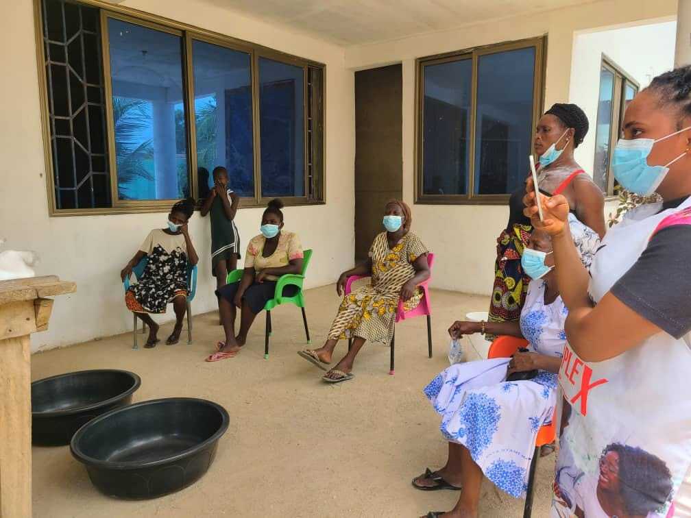 A community health awareness session with mothers and families in Cape Coast